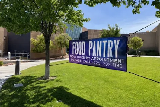 Food pantry appointment banner outside Desert Spring Community Resource Center.